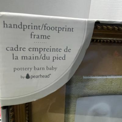 Sale Photo Thumbnail #1068: 17×10 inch frame with baby photo, handprint, footprint molds.