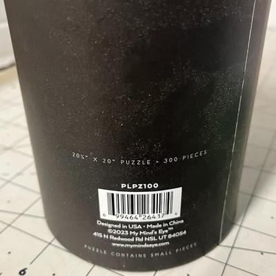 Sale Photo Thumbnail #1085: 20 1/4 × 20 inch puzzle, green monster design, round container