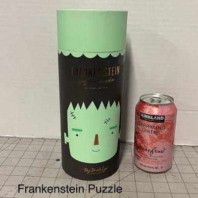 Sale Photo Thumbnail #1082: 20 1/4 × 20 inch puzzle, green monster design, round container