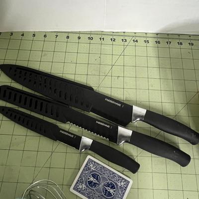 Sale Photo Thumbnail #1094: Includes knives, baking pan, strainer, opener, measuring cups, and Various utensils.