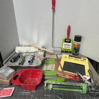 Sale Photo Thumbnail #1124: Includes rollers, tray, scraper, spray paint, sandpaper, caulking gun.