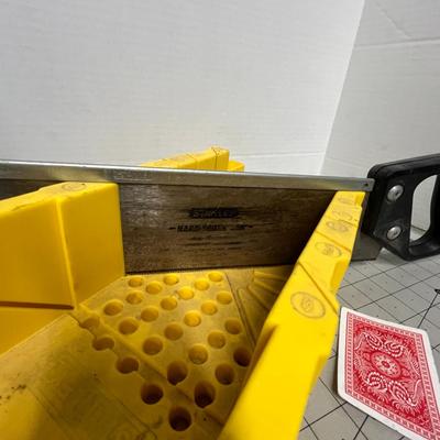 Sale Photo Thumbnail #1135: Includes saw and miter box; yellow plastic, black handle