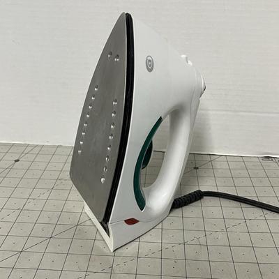 Sale Photo Thumbnail #1144: Electric iron with steam holes, green handle, black soleplate, corded.