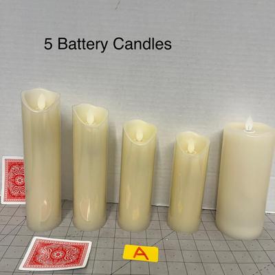 Sale Photo Thumbnail #1161: Five cream LED candles, assorted heights, warm glow, gently used.