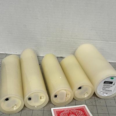 Sale Photo Thumbnail #1163: Five cream LED candles, assorted heights, warm glow, gently used.