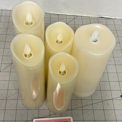 Sale Photo Thumbnail #1162: Five cream LED candles, assorted heights, warm glow, gently used.