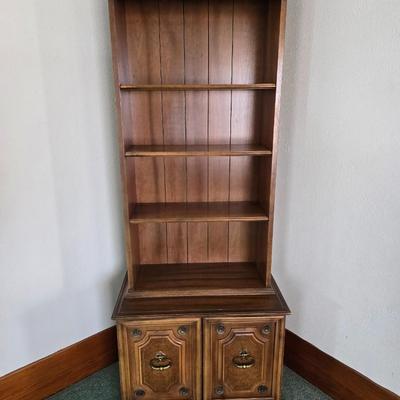 Vintage Chinoiserie library bookcase cabinet with upper shelves and a lower cabinet.