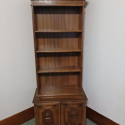 Vintage Chinoiserie library bookcase cabinet with upper shelves and a lower cabinet.