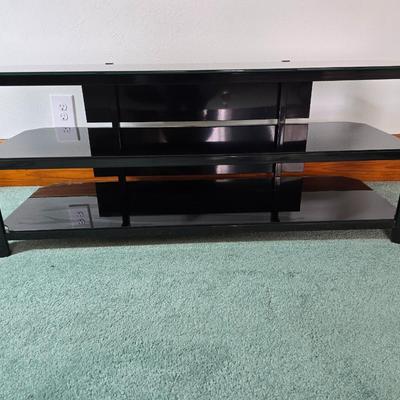 Innov-ex black tempered glass TV stand.