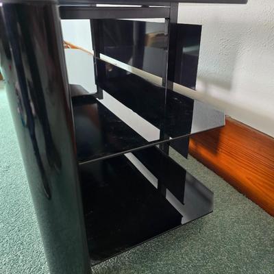 Innov-ex black tempered glass TV stand.