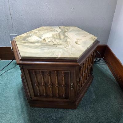 MCM hexagonal wood end table with a marble top and internal storage.