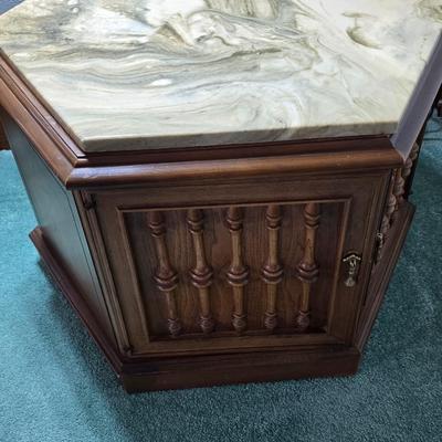 MCM hexagonal wood end table with a marble top and internal storage.