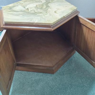 MCM hexagonal wood end table with a marble top and internal storage.