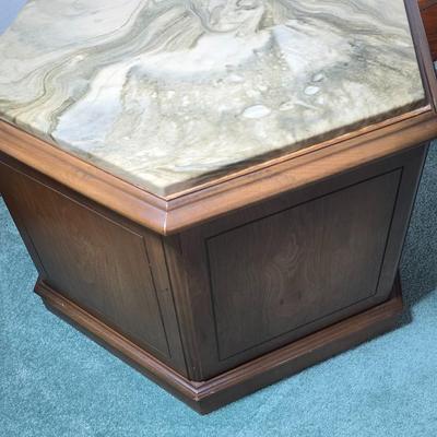 MCM hexagonal wood end table with a marble top and internal storage.