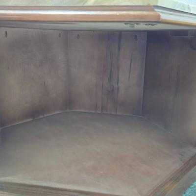 MCM hexagonal wood end table with a marble top and internal storage.