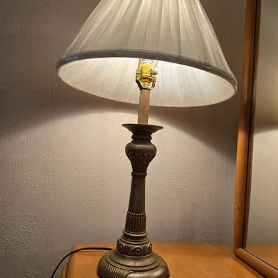 28" traditional-style brass table lamp with an ornate base and a white pleated shade