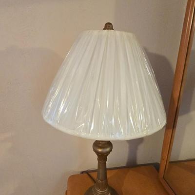 28" traditional-style brass table lamp with an ornate base and a white pleated shade
