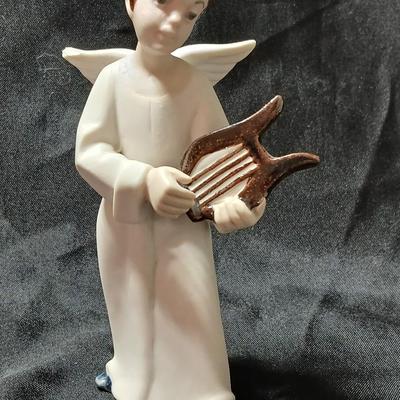 Rex Valencia porcelain boy angels playing musical instruments, handcrafted in Spain