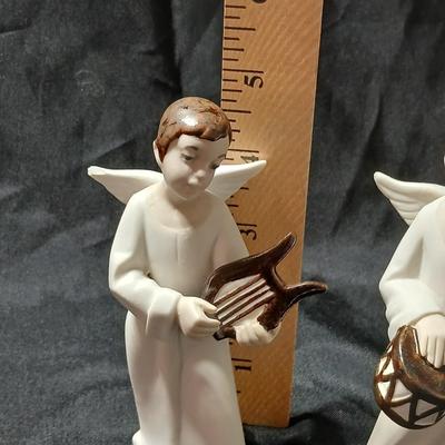 Rex Valencia porcelain boy angels playing musical instruments, handcrafted in Spain
