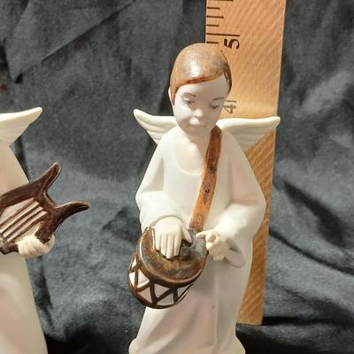 Rex Valencia porcelain boy angels playing musical instruments, handcrafted in Spain