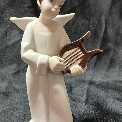 Rex Valencia porcelain boy angels playing musical instruments, handcrafted in Spain