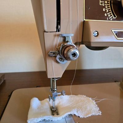 Singer 401A sewing machine, a vintage model known for its durability and functionality with sewing cabinet and some accessories