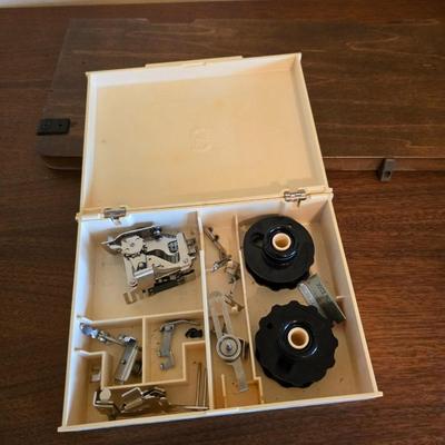 Singer 401A sewing machine, a vintage model known for its durability and functionality with sewing cabinet and some accessories