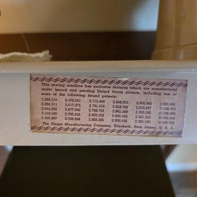 Singer 401A sewing machine, a vintage model known for its durability and functionality with sewing cabinet and some accessories
