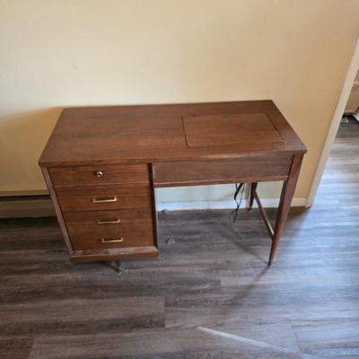 Singer 401A sewing machine, a vintage model known for its durability and functionality with sewing cabinet and some accessories