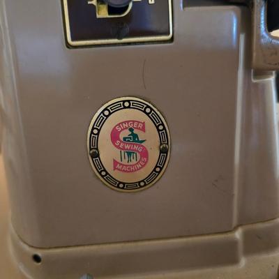 Singer 401A sewing machine, a vintage model known for its durability and functionality with sewing cabinet and some accessories