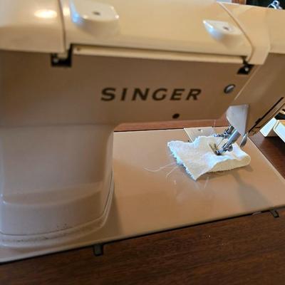 Singer 401A sewing machine, a vintage model known for its durability and functionality with sewing cabinet and some accessories