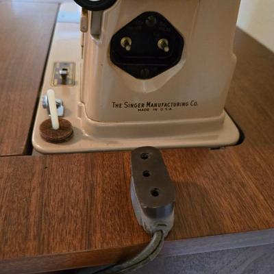 Singer 401A sewing machine, a vintage model known for its durability and functionality with sewing cabinet and some accessories