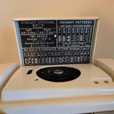 Singer 401A sewing machine, a vintage model known for its durability and functionality with sewing cabinet and some accessories