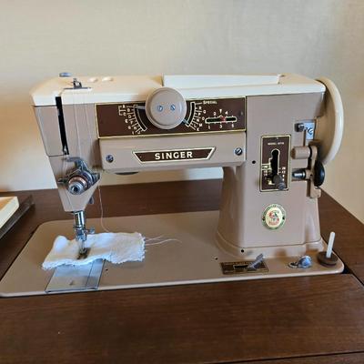 Singer 401A sewing machine, a vintage model known for its durability and functionality with sewing cabinet and some accessories