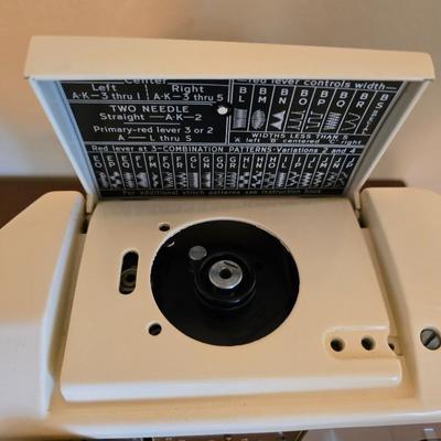 Singer 401A sewing machine, a vintage model known for its durability and functionality with sewing cabinet and some accessories