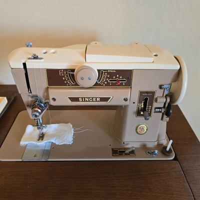 Singer 401A sewing machine, a vintage model known for its durability and functionality with sewing cabinet and some accessories