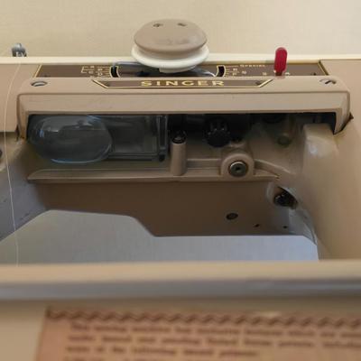 Singer 401A sewing machine, a vintage model known for its durability and functionality with sewing cabinet and some accessories