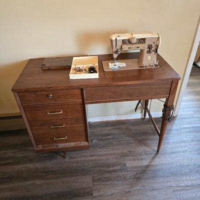 Singer 401A sewing machine, a vintage model known for its durability and functionality with sewing cabinet and some accessories