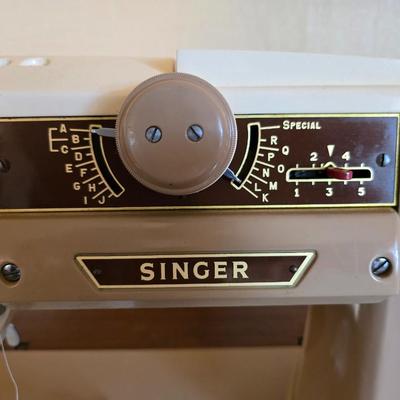 Singer 401A sewing machine, a vintage model known for its durability and functionality with sewing cabinet and some accessories