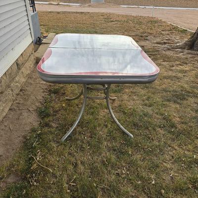 Vintage 1950s Mid-Century Modern gray and red Formica dinette table with chrome legs.