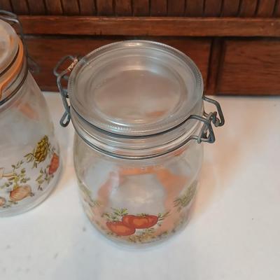 vintage glass canisters with a "Spice of Life" pattern, made by ARC in France. 1 & 2 Liter Jars with a trivet