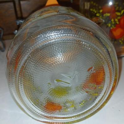 vintage glass canisters with a "Spice of Life" pattern, made by ARC in France. 1 & 2 Liter Jars with a trivet