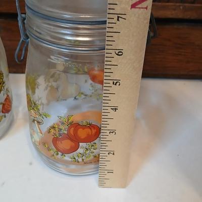 vintage glass canisters with a "Spice of Life" pattern, made by ARC in France. 1 & 2 Liter Jars with a trivet