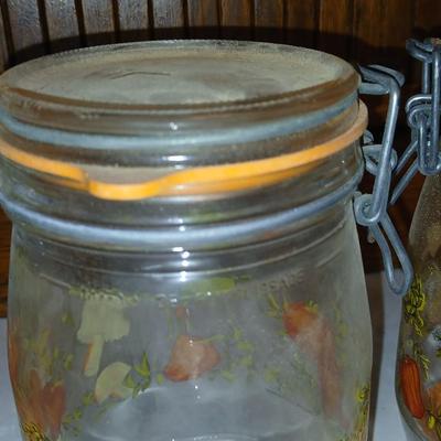 vintage glass canisters with a "Spice of Life" pattern, made by ARC in France. 1 & 2 Liter Jars with a trivet