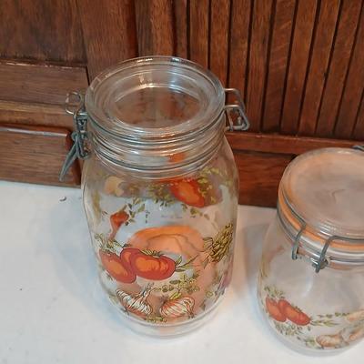 vintage glass canisters with a "Spice of Life" pattern, made by ARC in France. 1 & 2 Liter Jars with a trivet