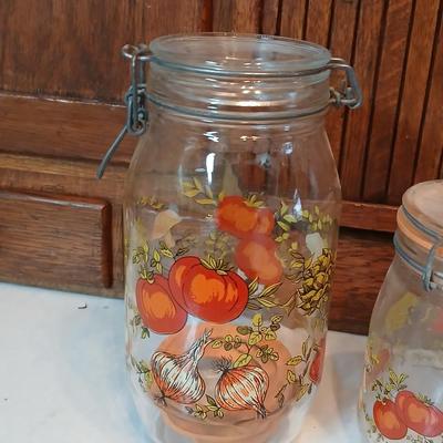 vintage glass canisters with a "Spice of Life" pattern, made by ARC in France. 1 & 2 Liter Jars with a trivet