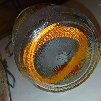 vintage glass canisters with a "Spice of Life" pattern, made by ARC in France. 1 & 2 Liter Jars with a trivet