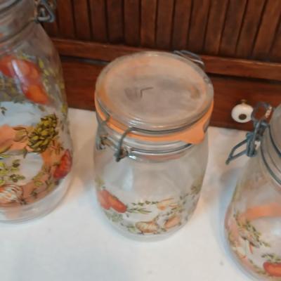 vintage glass canisters with a "Spice of Life" pattern, made by ARC in France. 1 & 2 Liter Jars with a trivet