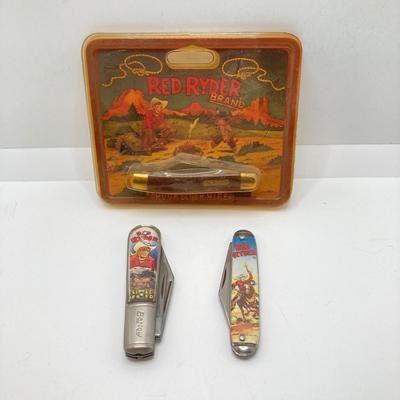 LOT 74: Collection of Red Ryder Memorabilia - Pocket Knives, Limited Edition Belt Buckle, Pocket Watch and More