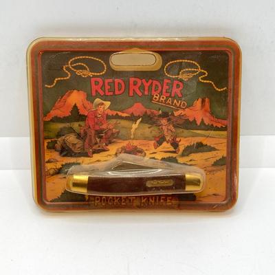 LOT 74: Collection of Red Ryder Memorabilia - Pocket Knives, Limited Edition Belt Buckle, Pocket Watch and More
